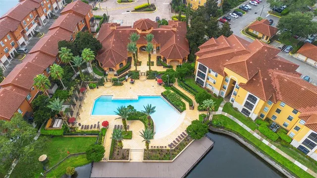 an aerial view of residential houses with outdoor space and street view