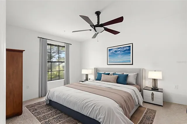 a bedroom with a large bed and a window