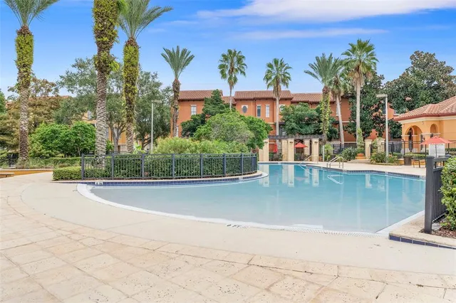 a view of a swimming pool and a yard