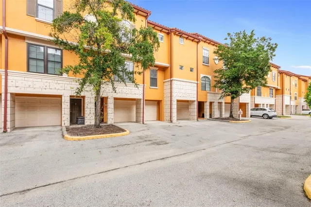 a view of a brick building next to a road