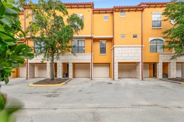 a view of a house with basketball court