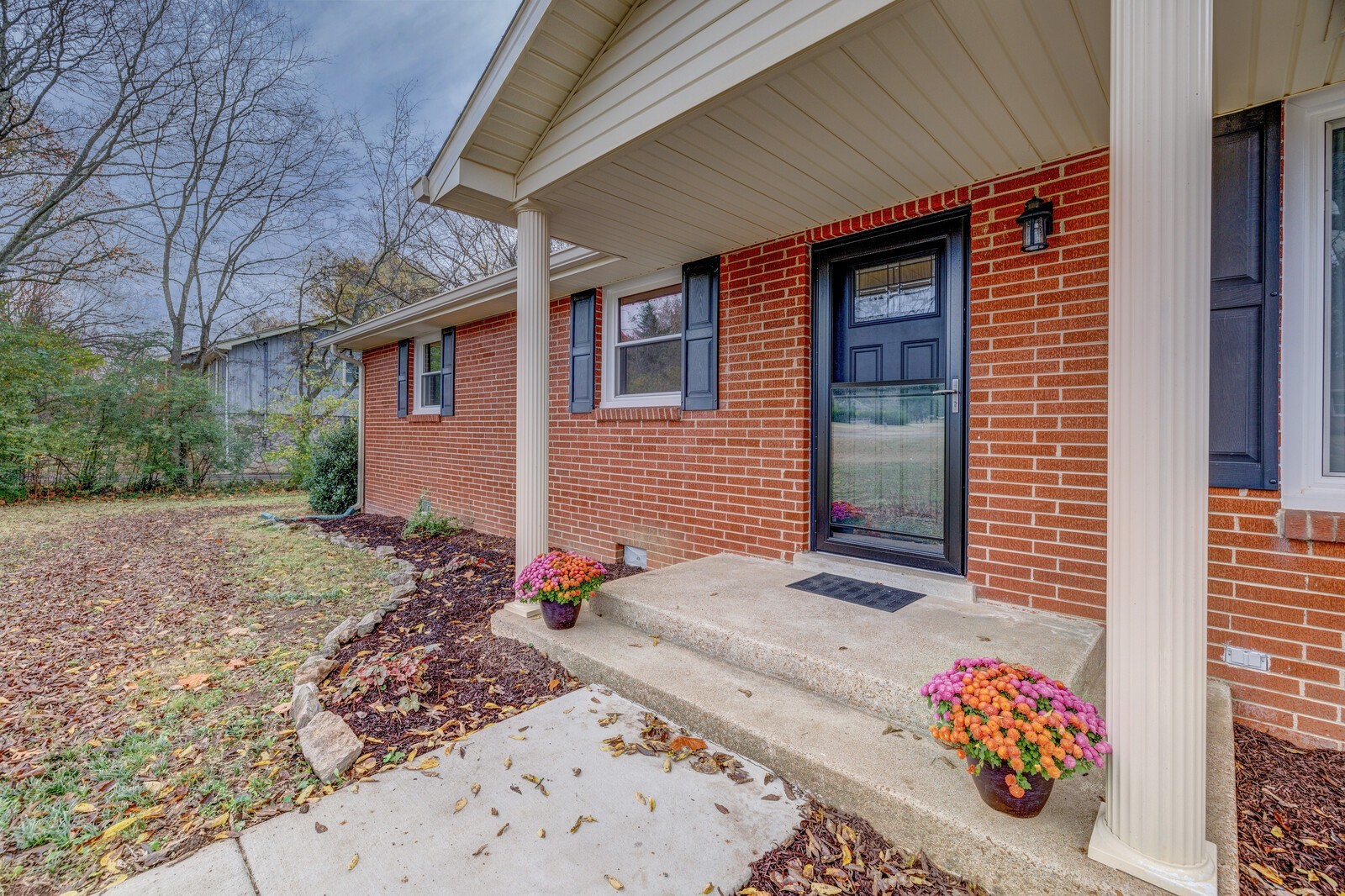 5075 Kittrell Road Nashville, TN 37221 - Photo 7 of 48 A covered front porch with a new front door and screen door greets you and your guests