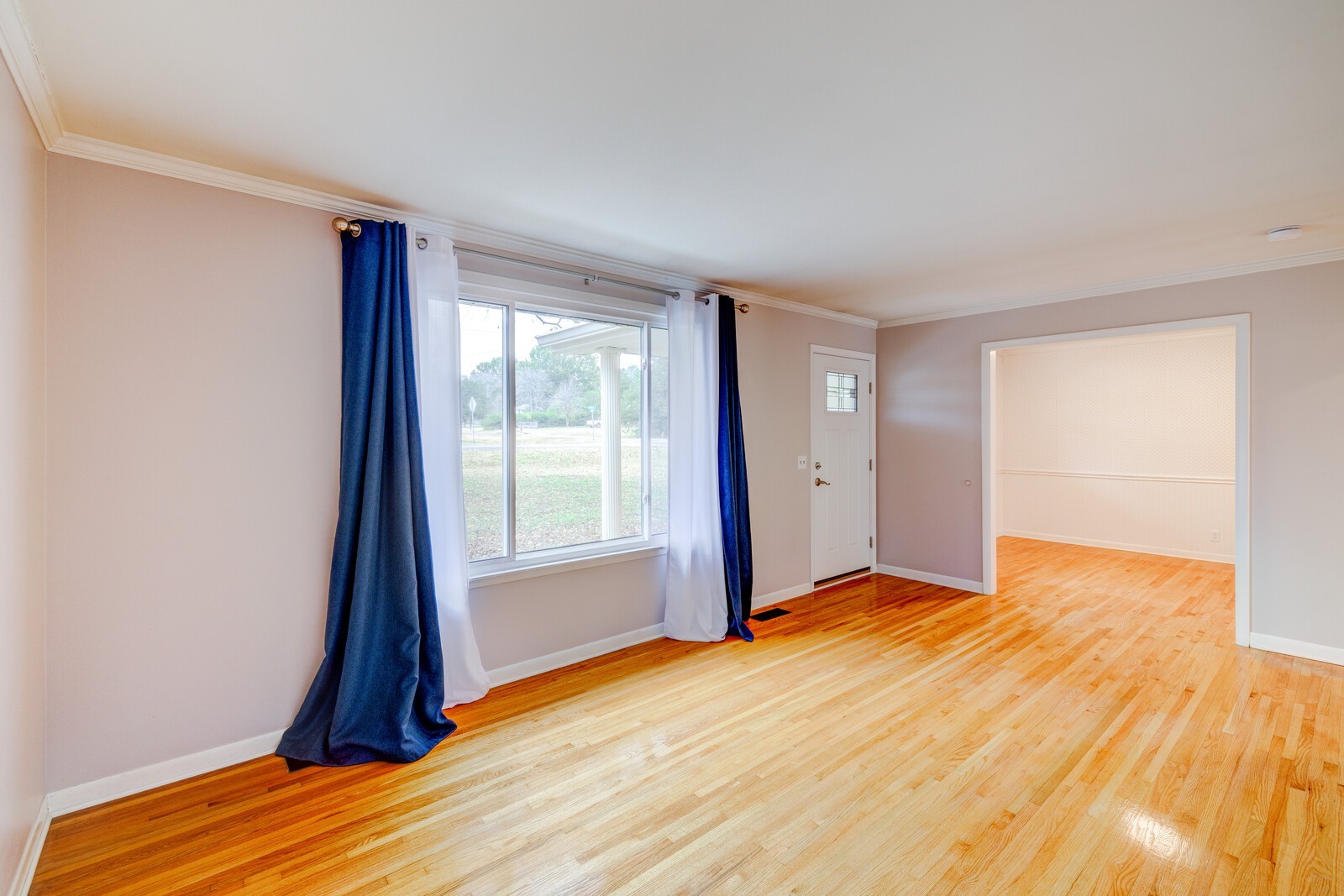 5075 Kittrell Road Nashville, TN 37221 - Photo 10 of 48 A large picture window brings natural light into the living room--the opening to the right is dining room/office space, which also opens into the hallway for a nice traffic flow