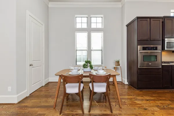 a view of a dining room with furniture and window