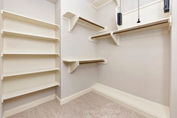 a view of an empty walk in closet