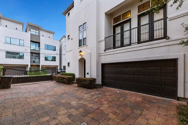 a view of a building with a yard in front of it