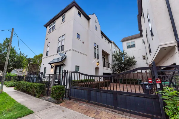 a view of a house with iron stairs