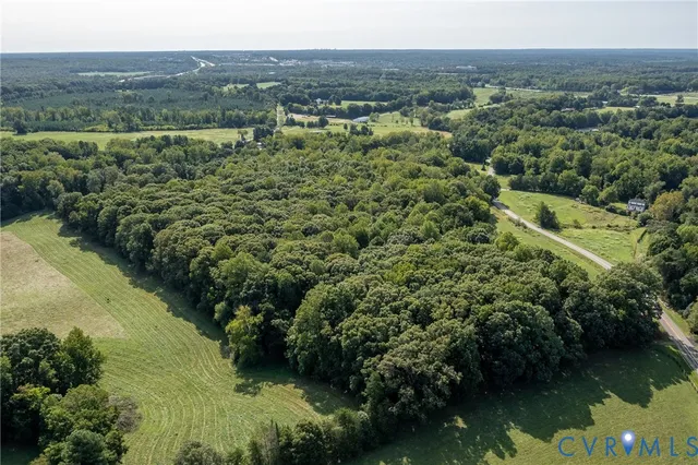 an aerial view of valley and lake