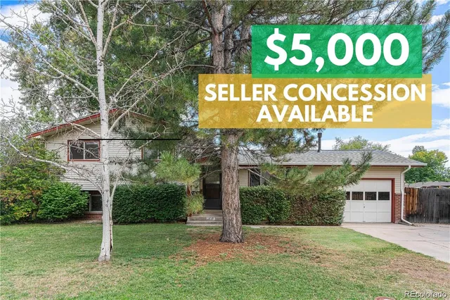 a view of outdoor space with sign board and garden