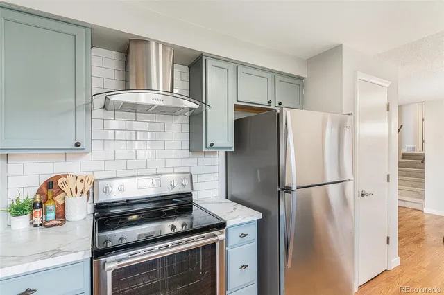 a kitchen with appliances and cabinets