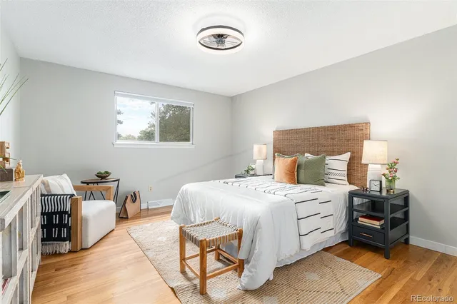 a bed room with a bed and a chair