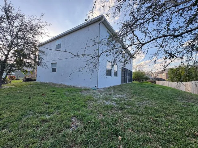 a backyard of a house with lots of green space