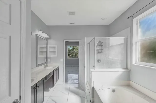 a bathroom with a bathtub shower sink and toilet