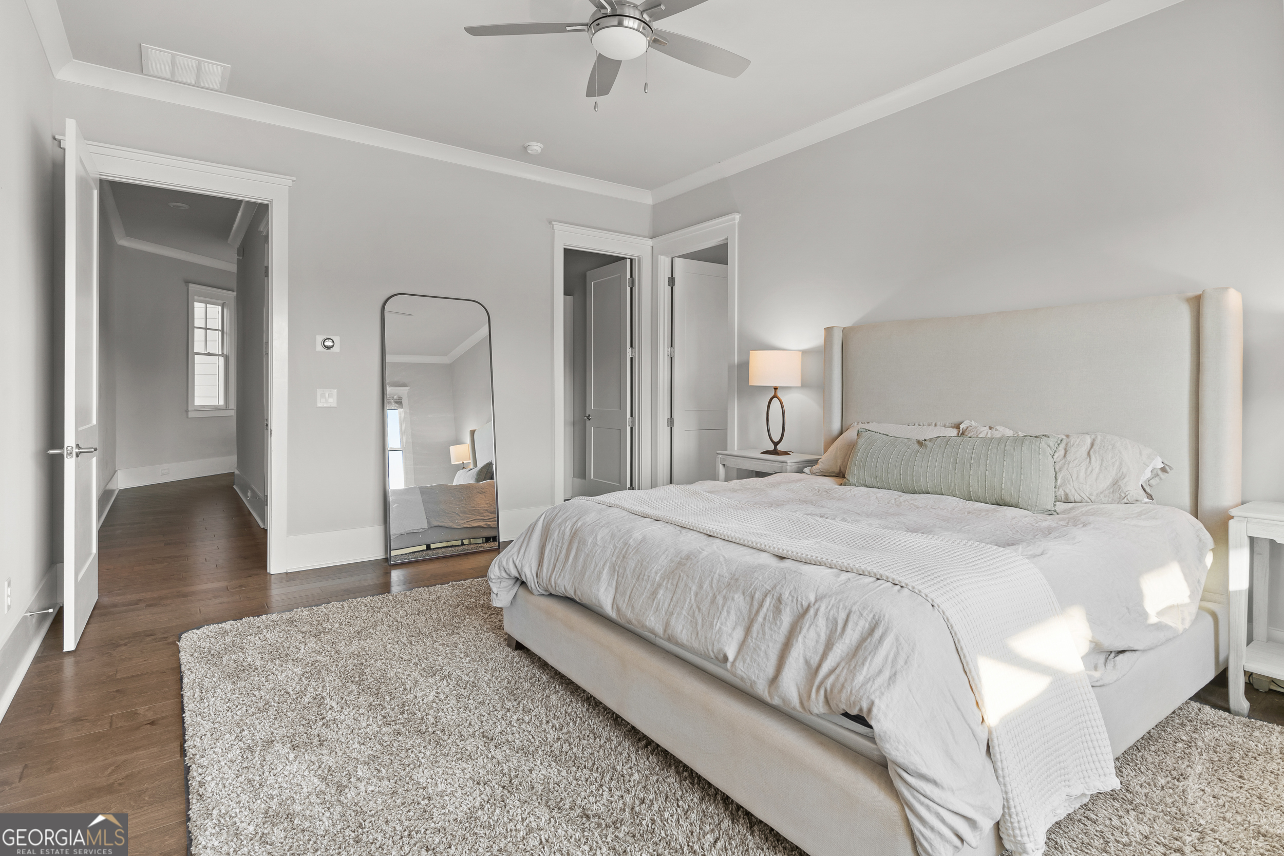 652 Meadow Run Court Clarkesville, GA 30523 - Photo 19 of 61 a spacious bedroom with a bed and a chandelier