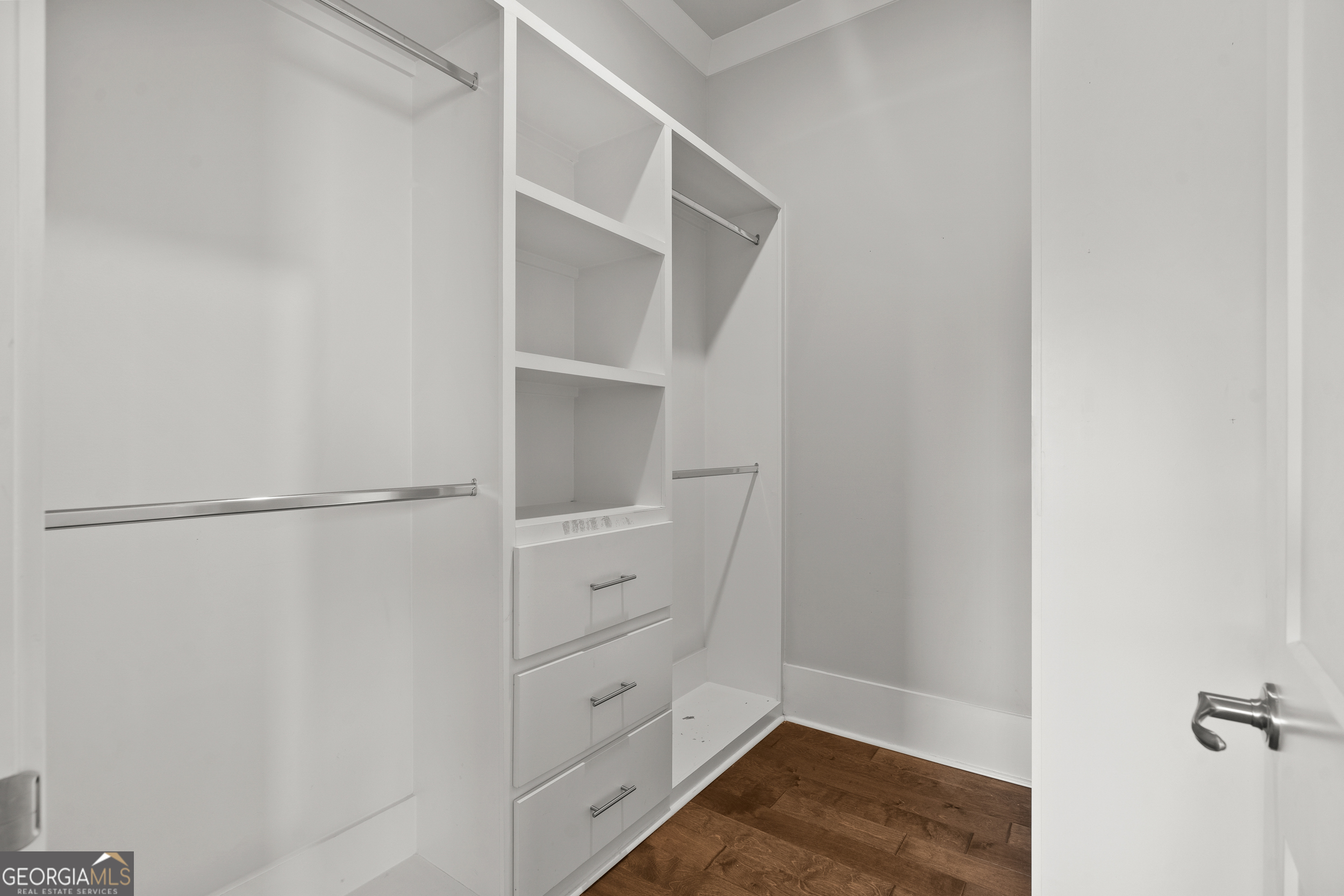 652 Meadow Run Court Clarkesville, GA 30523 - Photo 25 of 61 a view of walk in closet with empty racks