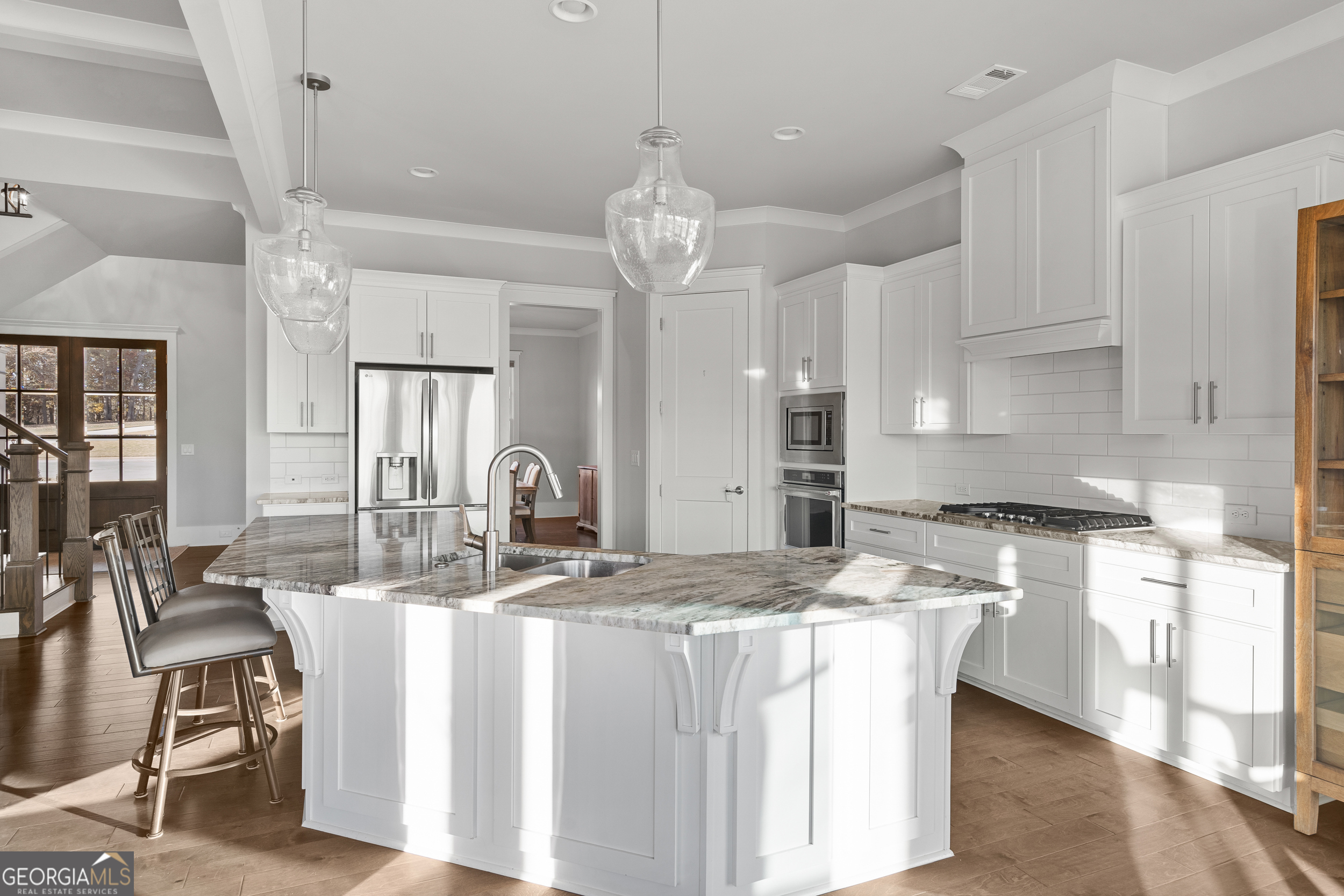 652 Meadow Run Court Clarkesville, GA 30523 - Photo 34 of 61 a kitchen with stainless steel appliances granite countertop a sink a stove and a refrigerator