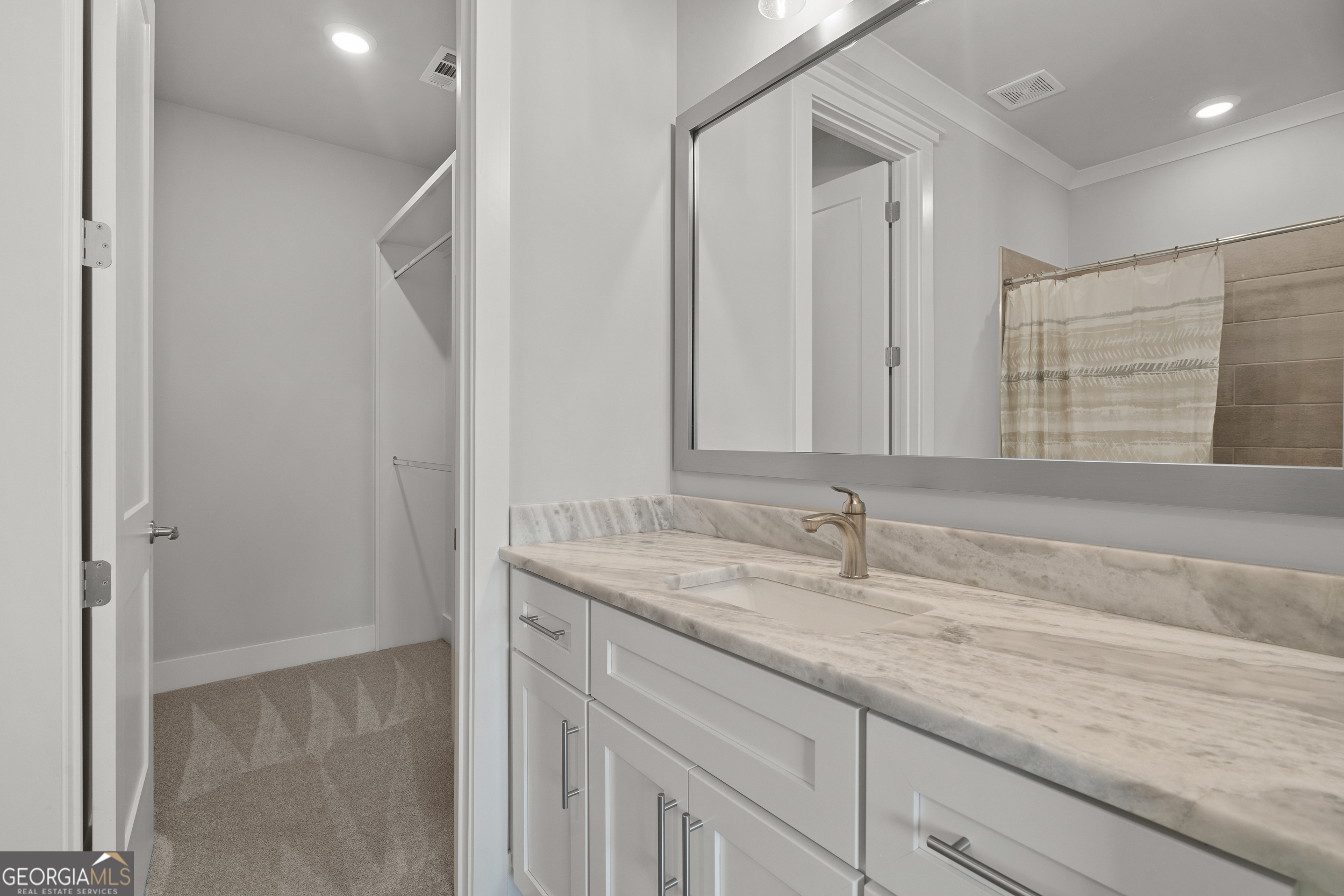 652 Meadow Run Court Clarkesville, GA 30523 - Photo 55 of 61 a bathroom with a granite countertop sink and a mirror