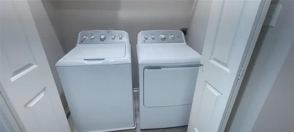 a utility room with dryer and washer