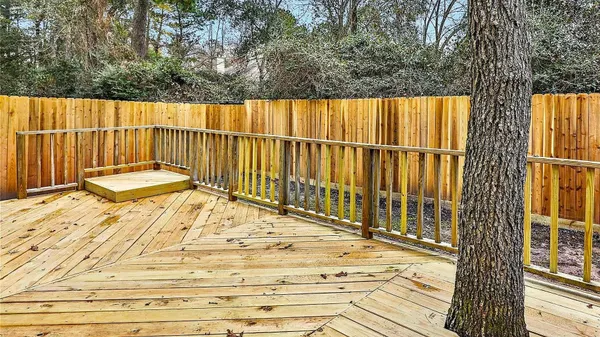 a view of wooden balcony with wooden floor