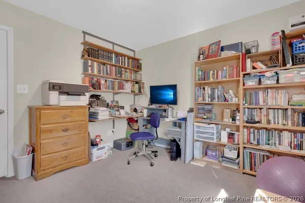 a room with toys and a book shelf