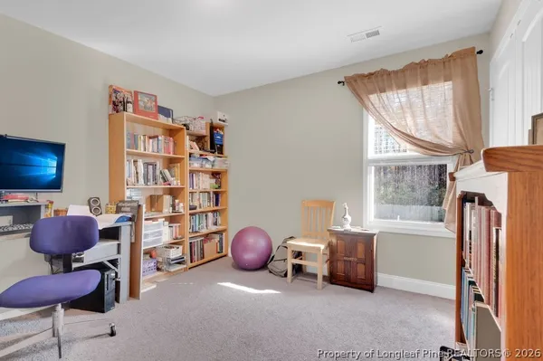 a livingroom with a large window and a couch