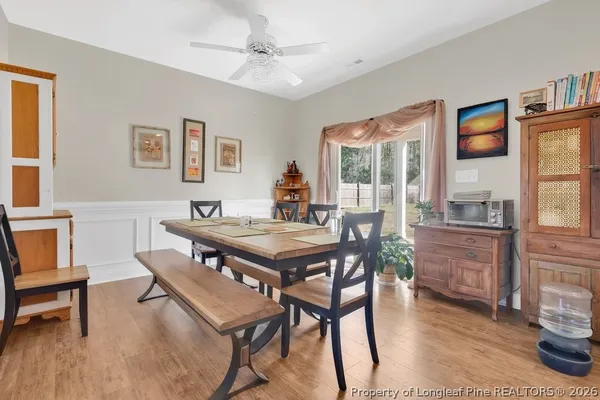 a view of a dining room with furniture window and wooden floor