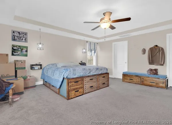 a bedroom with furniture and natural light