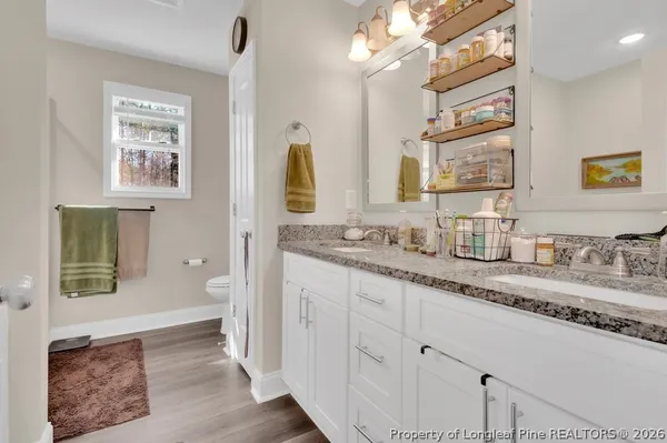 a bath room with a sink and a mirror