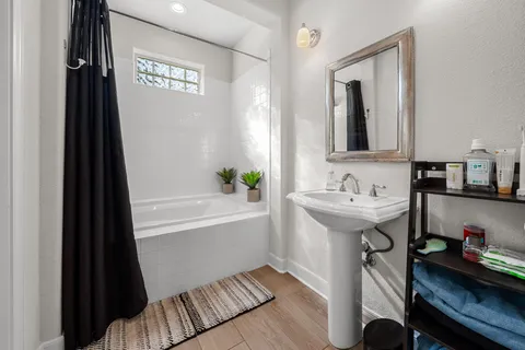 a bedroom with furniture and a window