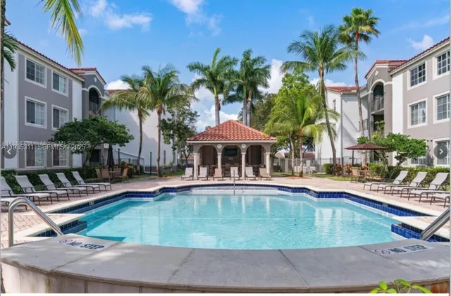 a view of a swimming pool with chairs