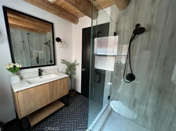 a bathroom with a sink and mirror