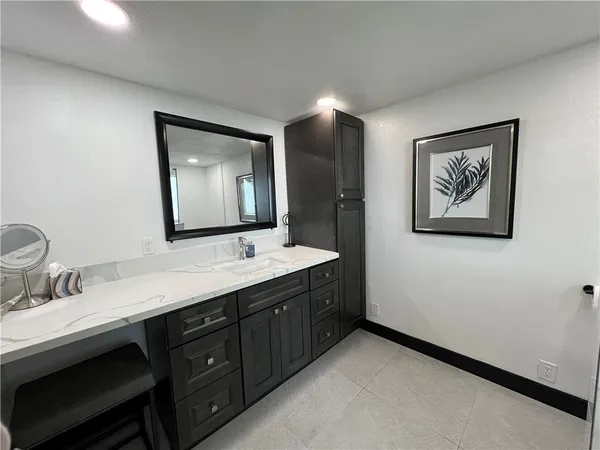 a bathroom with a double vanity sink and mirror