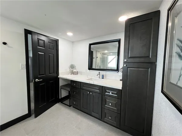 a view of a pathway of a house with a fountain