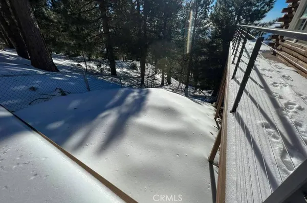 a view of backyard with swimming pool and outdoor seating