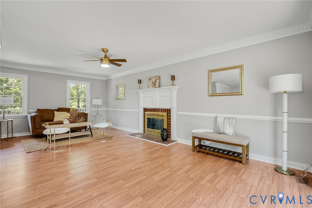 10110 Holly Road Mechanicsville, VA 23116 - Photo 9 of 26 Spacious living area featuring wood-finish floorin