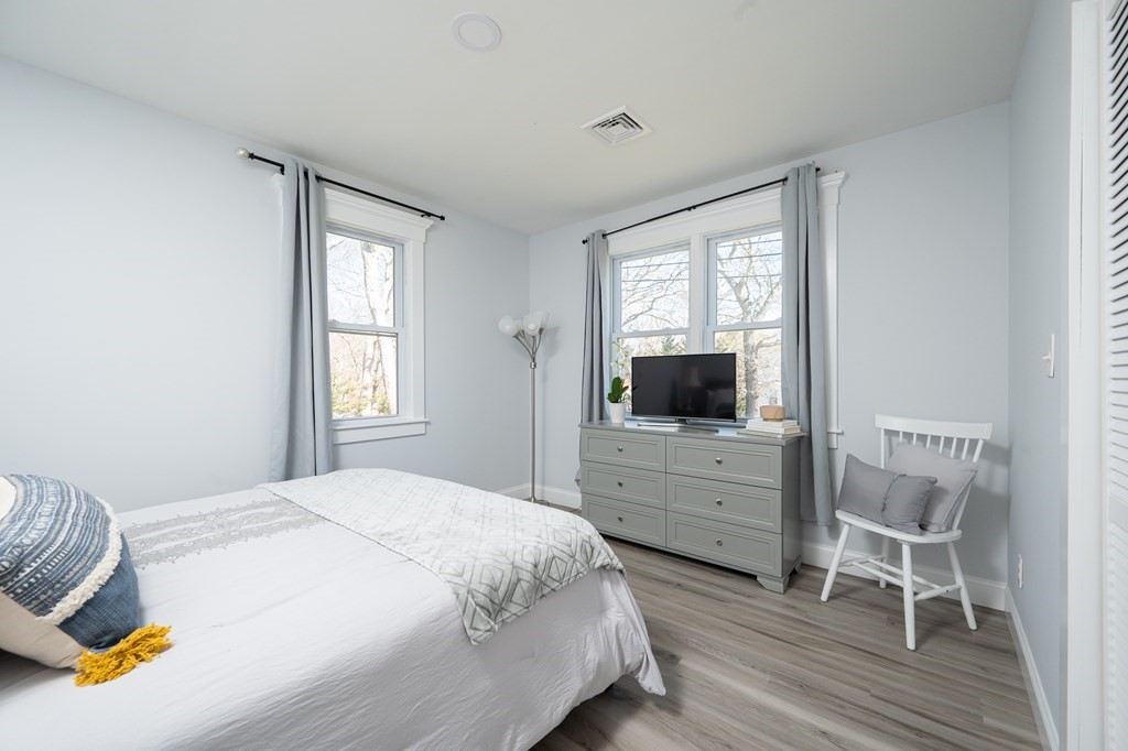 19 Huckins Neck Road Centerville, MA 02632 - Photo 13 of 42 a bedroom with a bed and a flat screen tv
