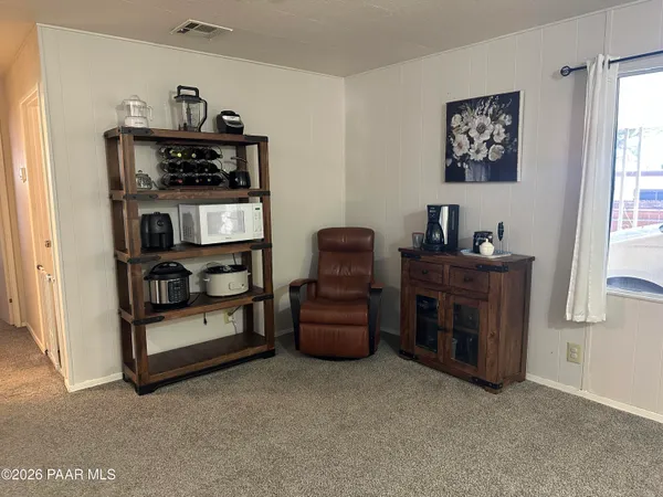 a view of workspace with furniture and window