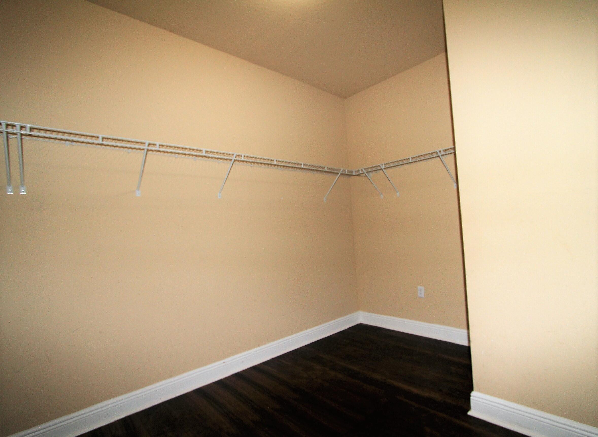 639 Red Fern Road Crestview, FL 32536 - Photo 17 of 24 a view of a small space with wooden floor and a window
