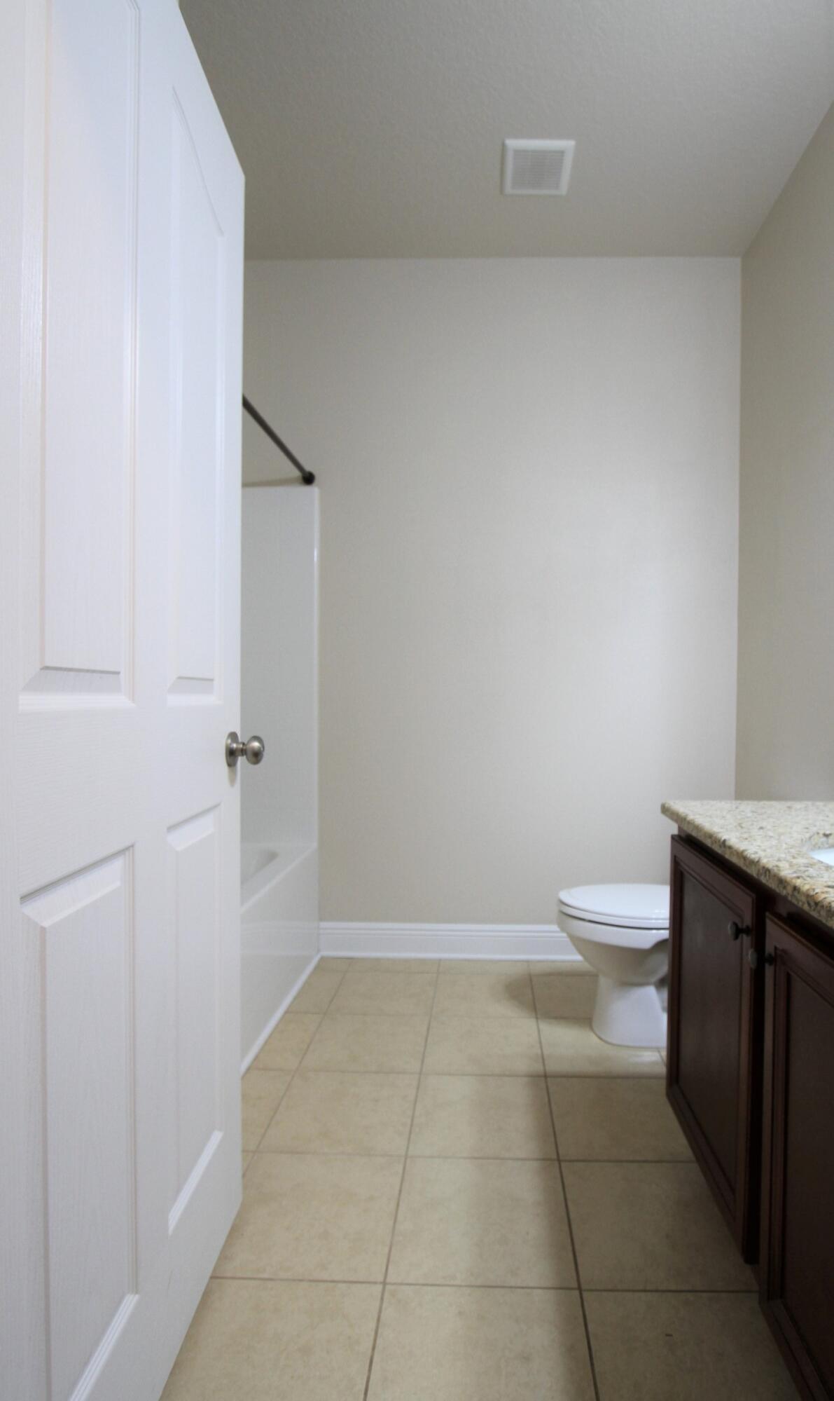 639 Red Fern Road Crestview, FL 32536 - Photo 19 of 24 a bathroom with a toilet a sink and vanity