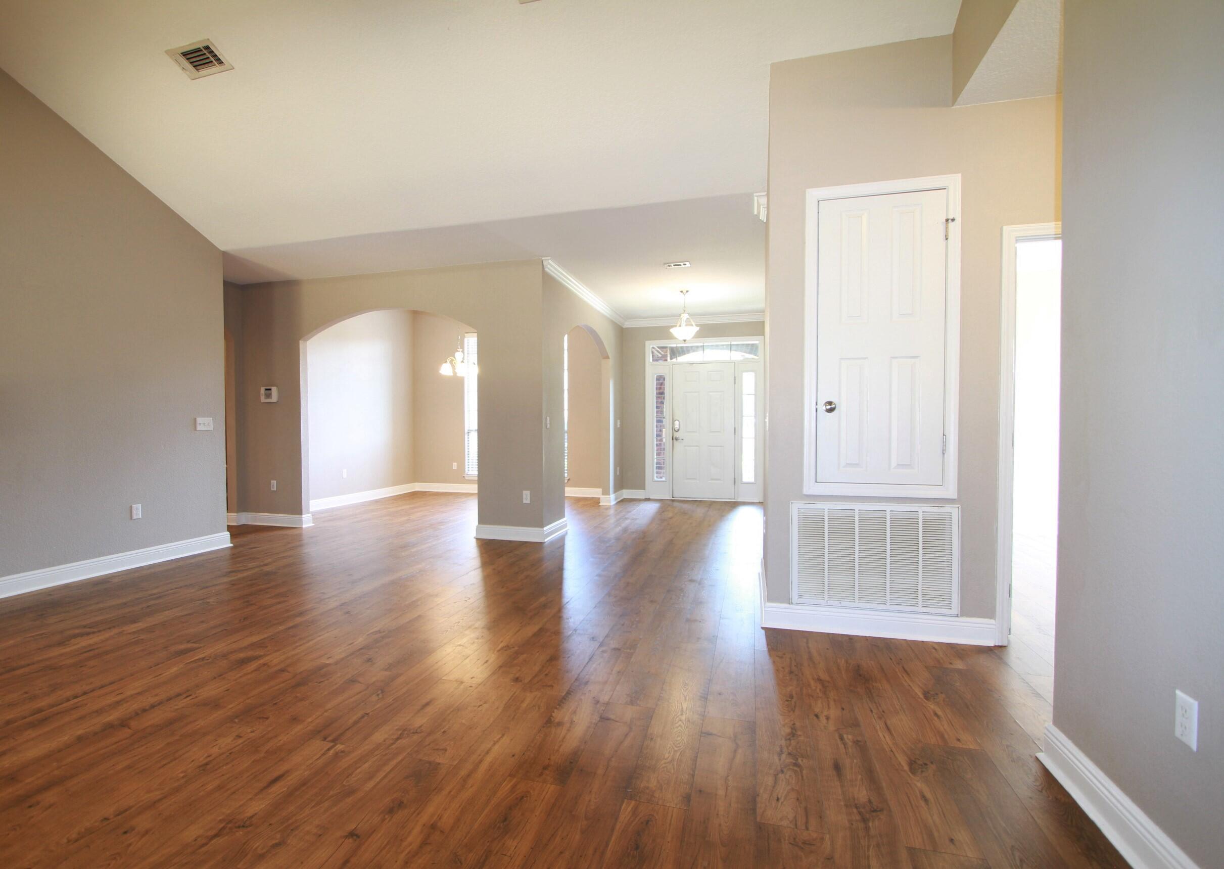 639 Red Fern Road Crestview, FL 32536 - Photo 6 of 24 a view of a hallway with wooden floor