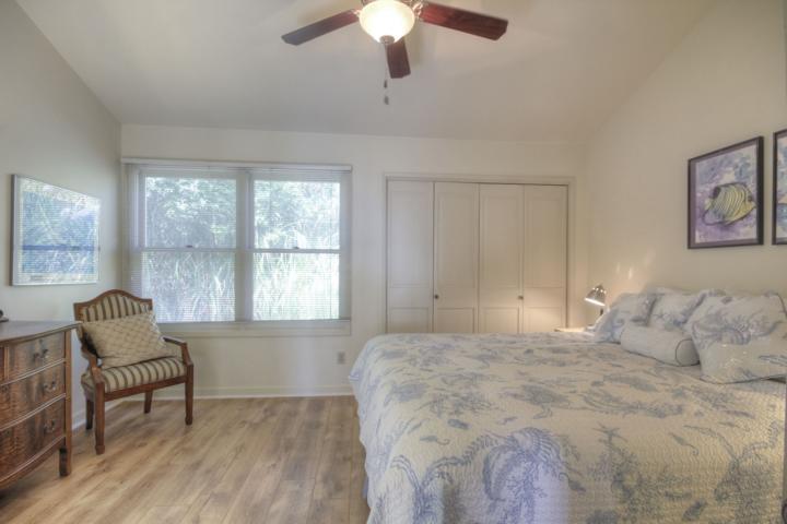 5005 Cliff Drive, Unit 2 Capitola, CA 95010 - Photo 15 of 21 a bedroom with a bed and a chandelier