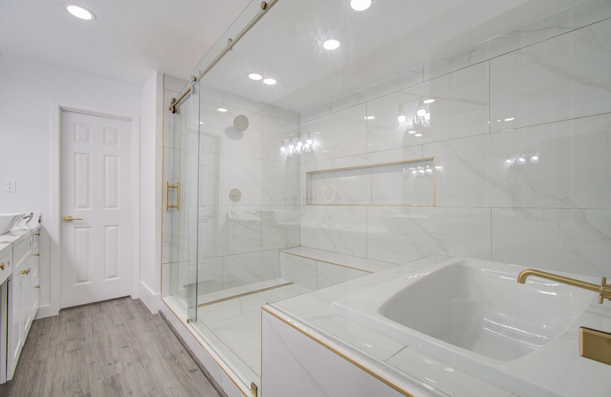 556 Brandon Road Conroe, TX 77302 - Photo 1 of 28 a bathroom with a bathtub and a shower