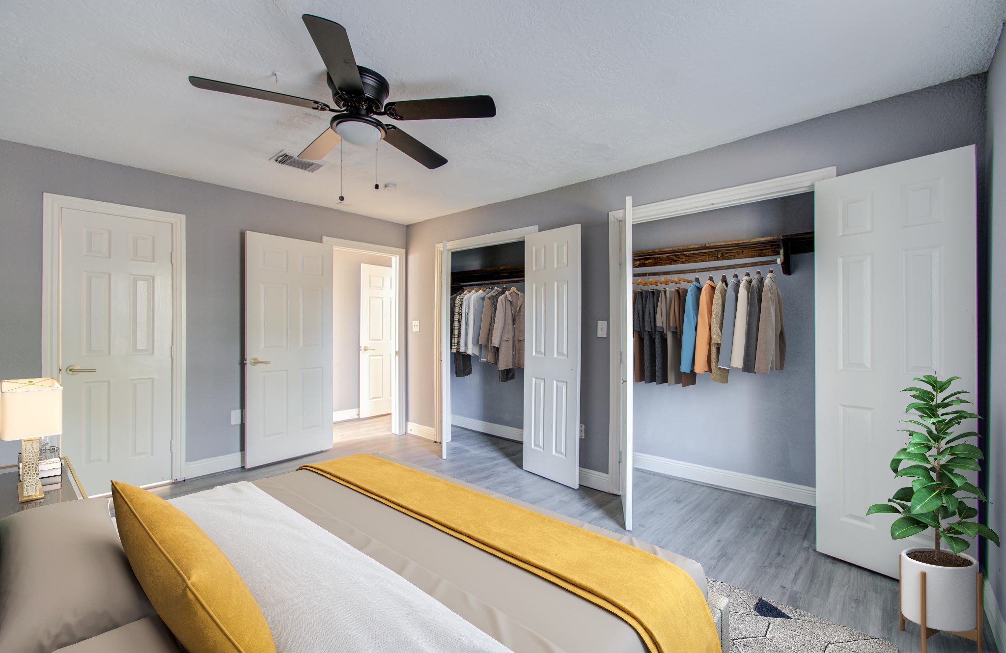 556 Brandon Road Conroe, TX 77302 - Photo 12 of 28 a bedroom with a bed and a potted plant