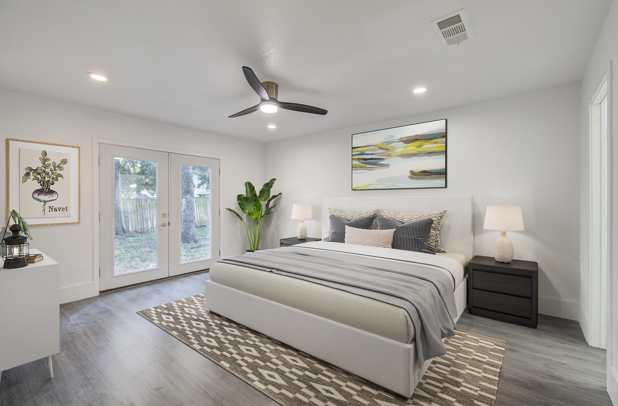 556 Brandon Road Conroe, TX 77302 - Photo 21 of 28 a spacious bedroom with a large bed a rug and a window