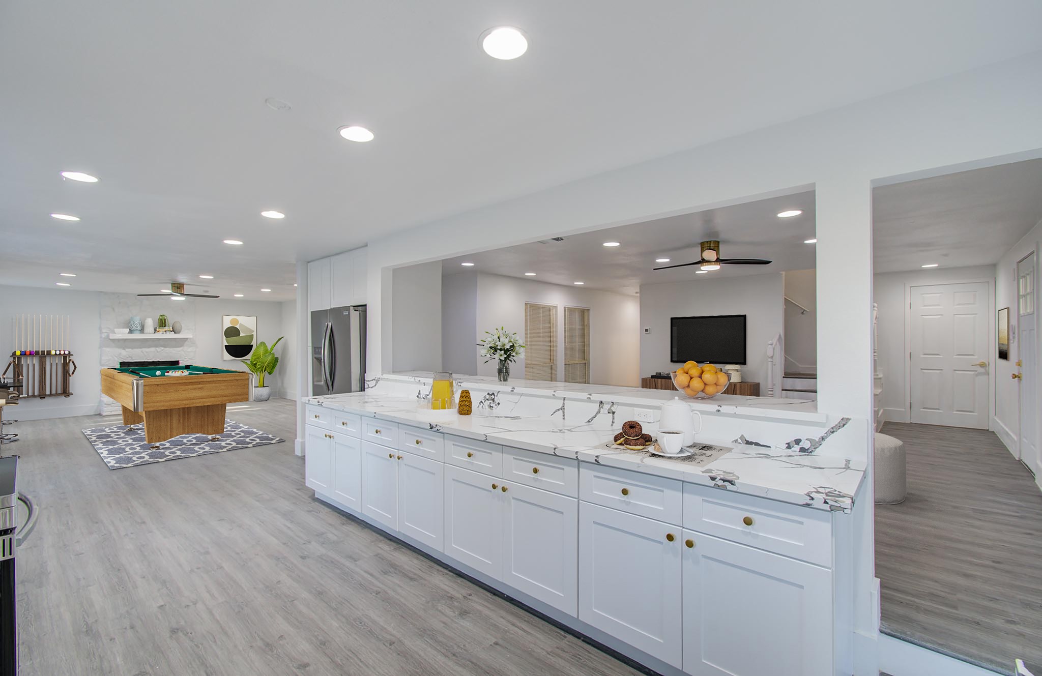 556 Brandon Road Conroe, TX 77302 - Photo 6 of 28 a view of kitchen with stainless steel appliances kitchen island sink stove and living room with wooden floor