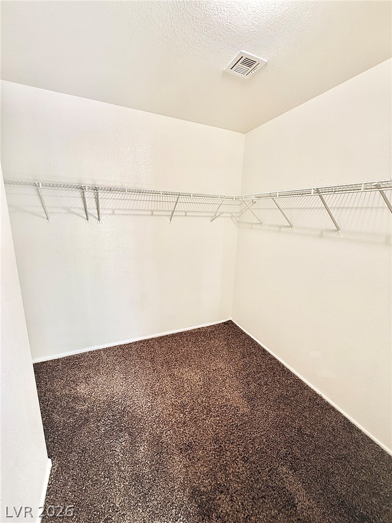 4313 Ranch Foreman Road North Las Vegas, NV 89032 - Photo 14 of 27 Ample wire shelving wraps around this carpeted walk-in closet.