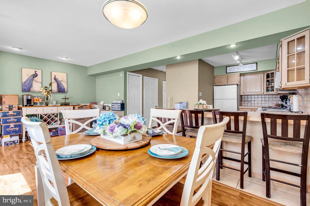 1964 East Oak Road, Unit K4 Vineland, NJ 08361 - Photo 11 of 25 a view of a dining room with furniture and a kitchen