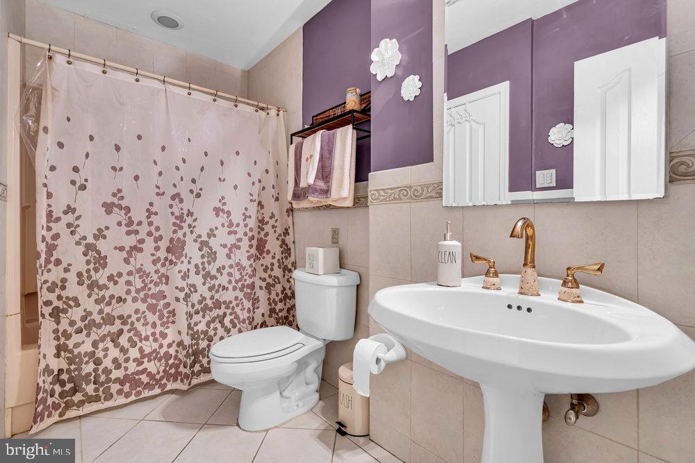 1964 East Oak Road, Unit K4 Vineland, NJ 08361 - Photo 15 of 25 a bathroom with a sink toilet and shower