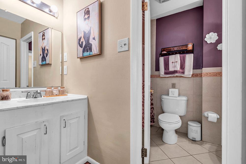 1964 East Oak Road, Unit K4 Vineland, NJ 08361 - Photo 18 of 25 a bathroom with a toilet sink and mirror