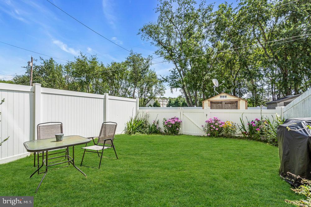 1964 East Oak Road, Unit K4 Vineland, NJ 08361 - Photo 20 of 25 a view of a backyard with plants and a garden